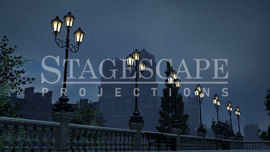 Paris Riverside Promenade static scenic projection backdrop for & Juliet — oil lamps along the Seine with Notre Dame in the distance. Five lighting states from dusk to night. StageScape Projections.