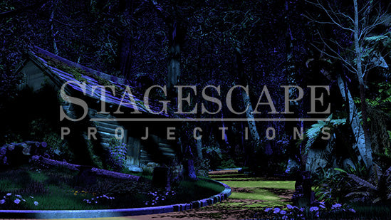 The TinWoodman's Cottage scenic projection backdrop for The Wizard of Oz - dark log cottage with moss and purple flowering boughs, kerbed yellow brick road, stark white birch trees and cascading ferns against deep forest. StageScape Projections.
