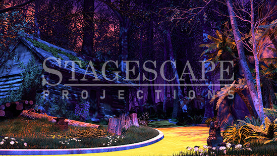 The TinWoodman's Cottage scenic projection backdrop for The Wizard of Oz - dark log cottage with moss and purple flowering boughs, kerbed yellow brick road, stark white birch trees and cascading ferns against deep forest. StageScape Projections.