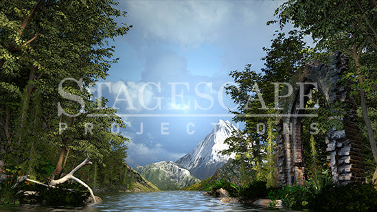 3D-rendered lakeside scenic projection backdrop for Swan Lake ballet, featuring gothic ruin, framed trees and distant mountains.
