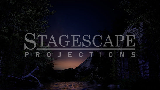 3D-rendered lakeside scenic projection backdrop for Swan Lake ballet, featuring gothic ruin, framed trees and distant mountains.